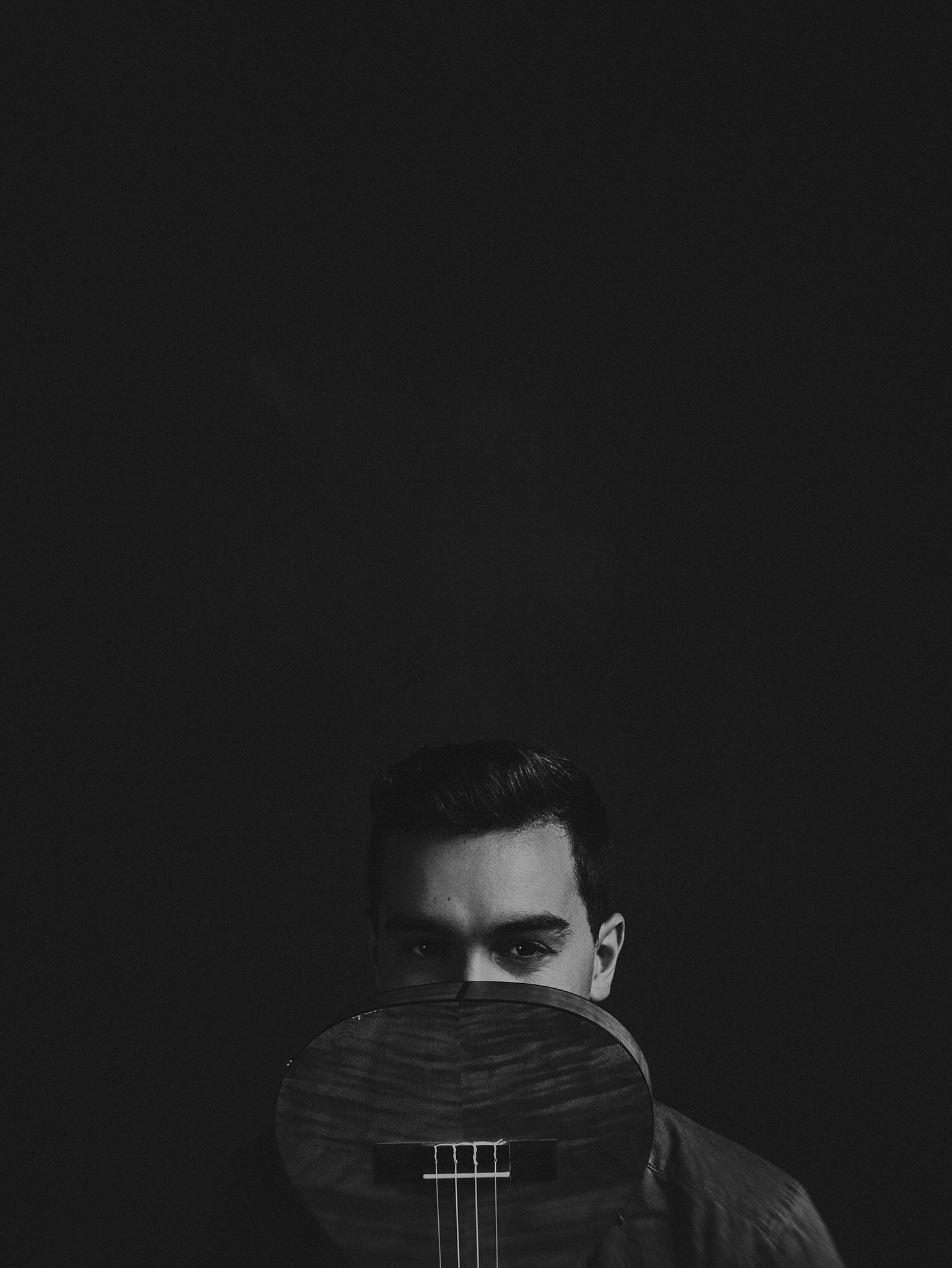 black and white portrait of male musician taken at Cowra NSW Australia photography studio